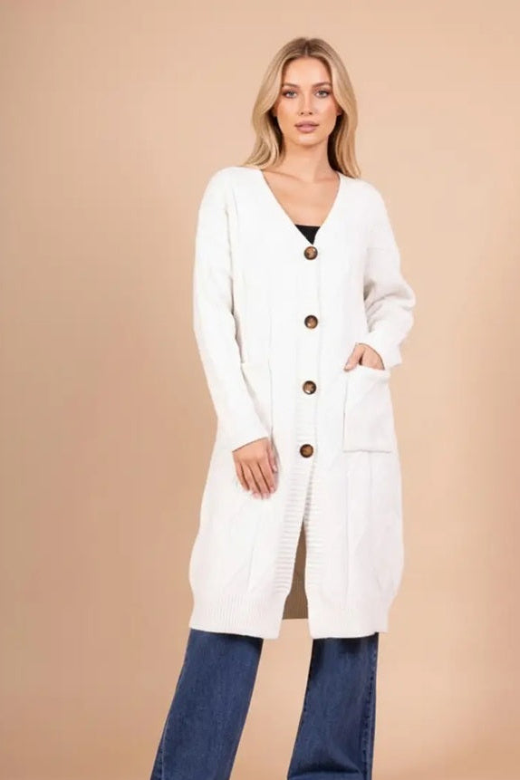 Άσπρη μακριά πλεκτή ζακέτα με κουμπιά και τσέπες μπροστά